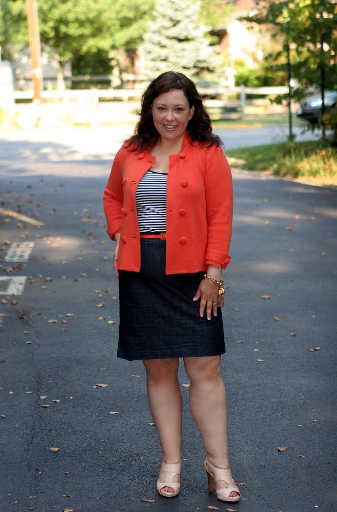 Alison Gary of Wardrobe Oxygen in an orange J. Crew sweater jacket and denim pencil skirt 