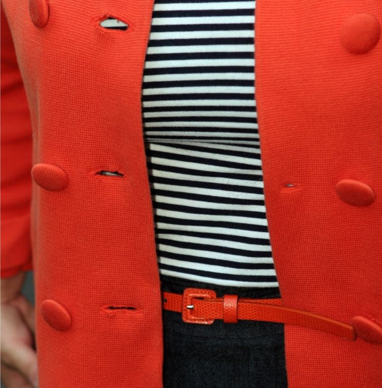 Alison Gary of Wardrobe Oxygen in an orange J. Crew sweater jacket and denim pencil skirt 