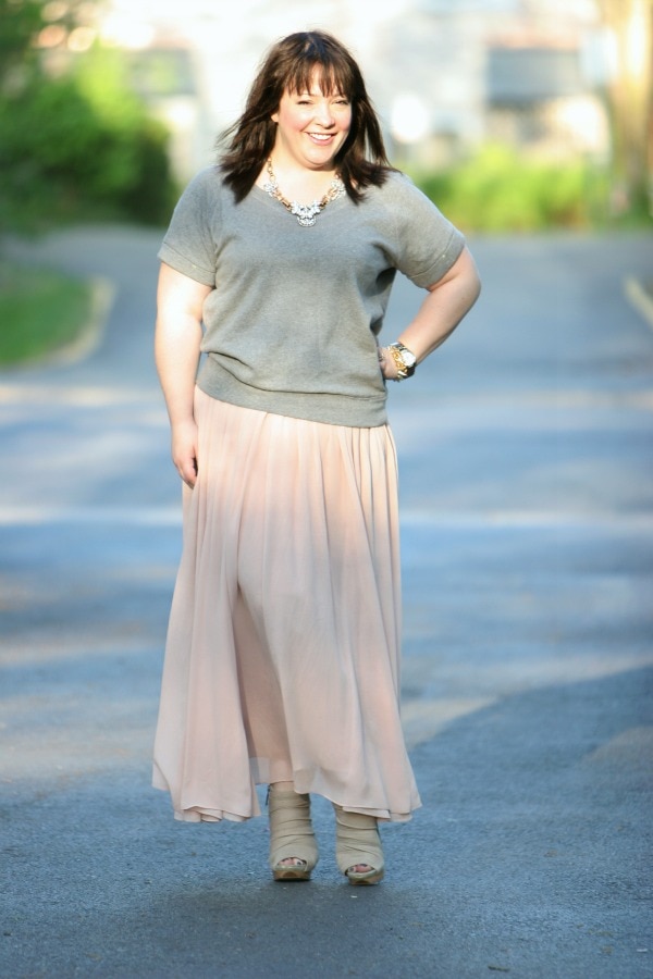 Alison Gary in a gray short sleeved sweatshirt and long ballet pink chiffon skirt from Ann Taylor