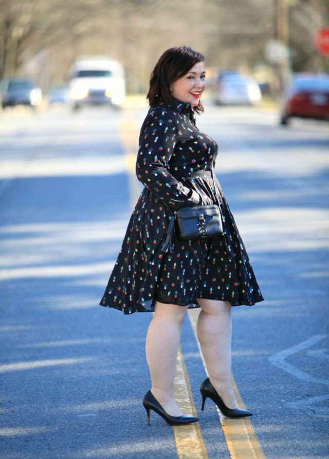 Wardrobe Oxygen in an Eloquii Conversational Dress, Rebecca Minkoff bag, and Baublebar tassel earrings