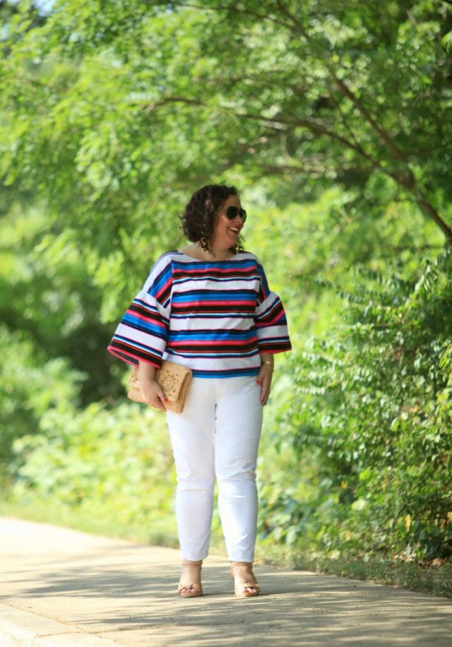 Wardrobe Oxygen in a candy striped cotton bell sleeve blouse from Vince Camuto with white Talbots ankle jeans, Aerosoles sandals, and a raffia clutch