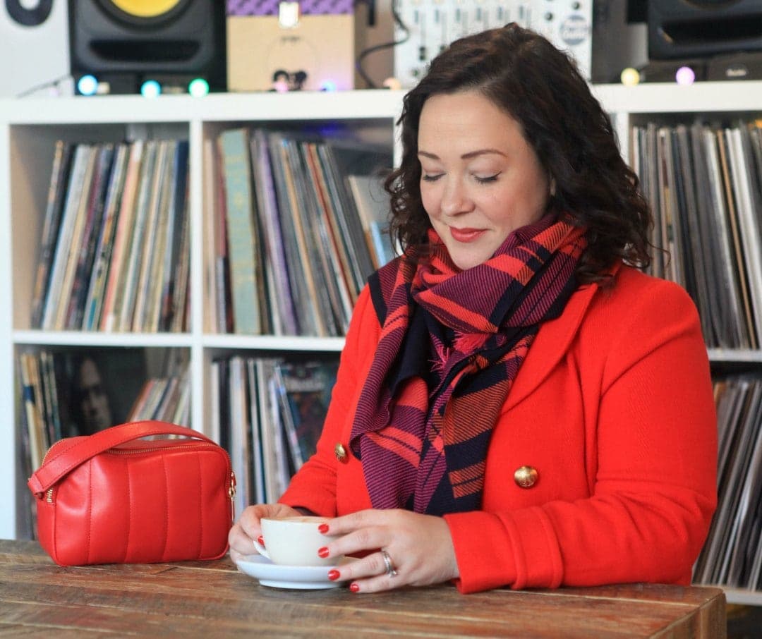 Wardrobe Oxygen in a red Talbots peacoat, plaid scarf, and purple leather gloves with Talbots Flawless Fit bootcut jeans