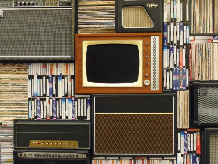 Weekend Reads #60 1 stack of CRT televisions and vintage speakers with VHS video tapes
