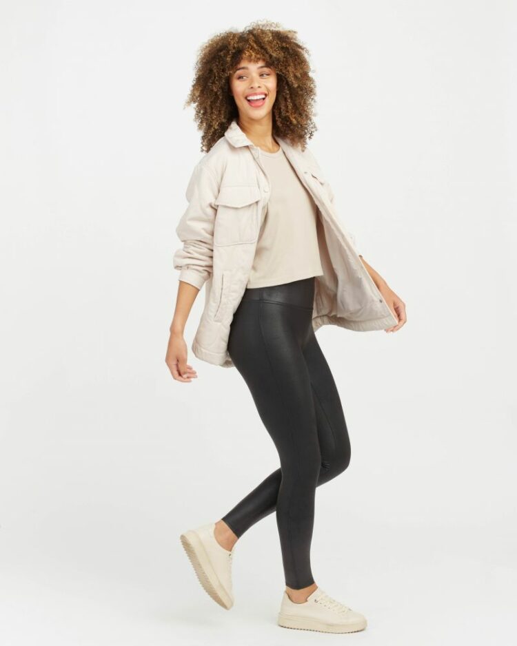 a model wearing Spanx faux leather leggings