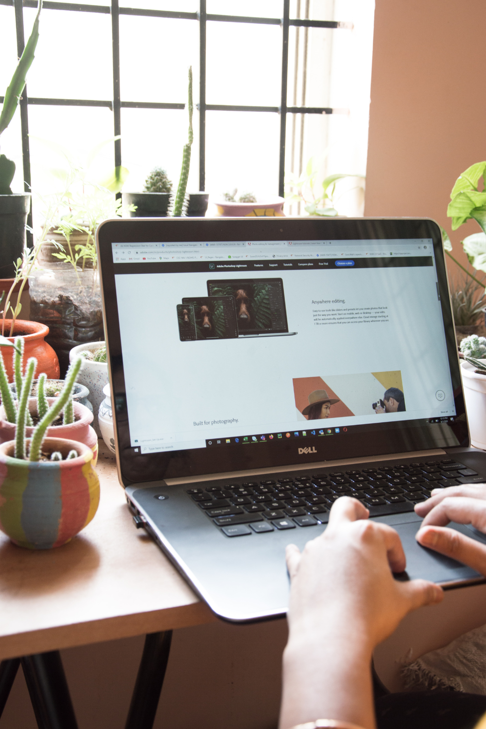 woman sitting at a desk working on a blog while typing on a laptop computer. It has been a hell of a few years