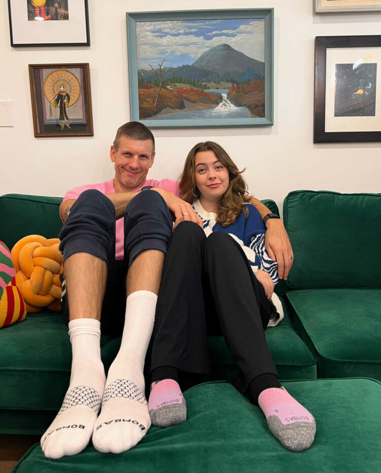 husband and teenage daughter wearing Bombas socks My husband and teenage daughter sitting on a couch in loungewear. My husband is wearing the Bombas Original Crew socks in white, my daughter a pair of Bombas Ankle Running Socks in a colorway of pink, lavender, gray, and black.