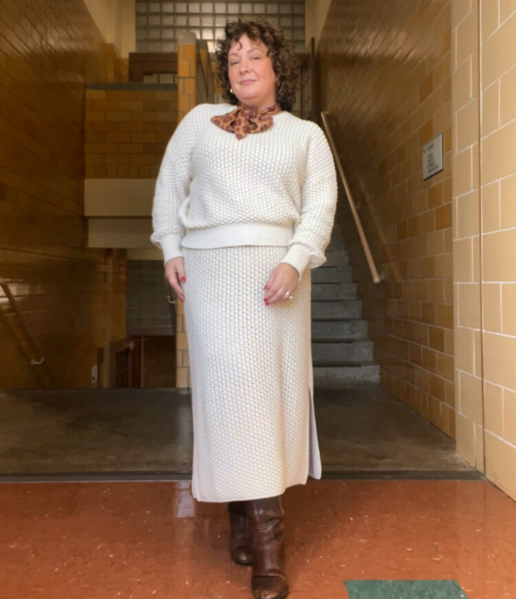 Alison in a M.M.LaFleur popcorn sweater and matching midi skirt with a paisley scarf at the throat.