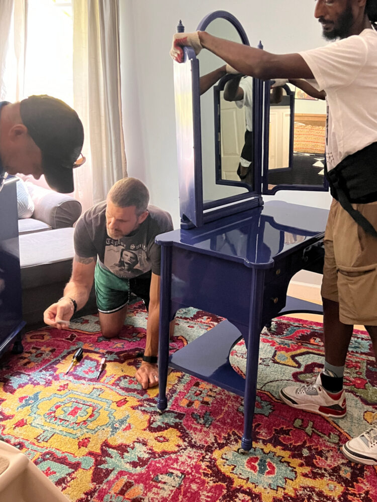 The two gentlemen from Easy Movers DC and my husband attaching the mirror to my dressing table