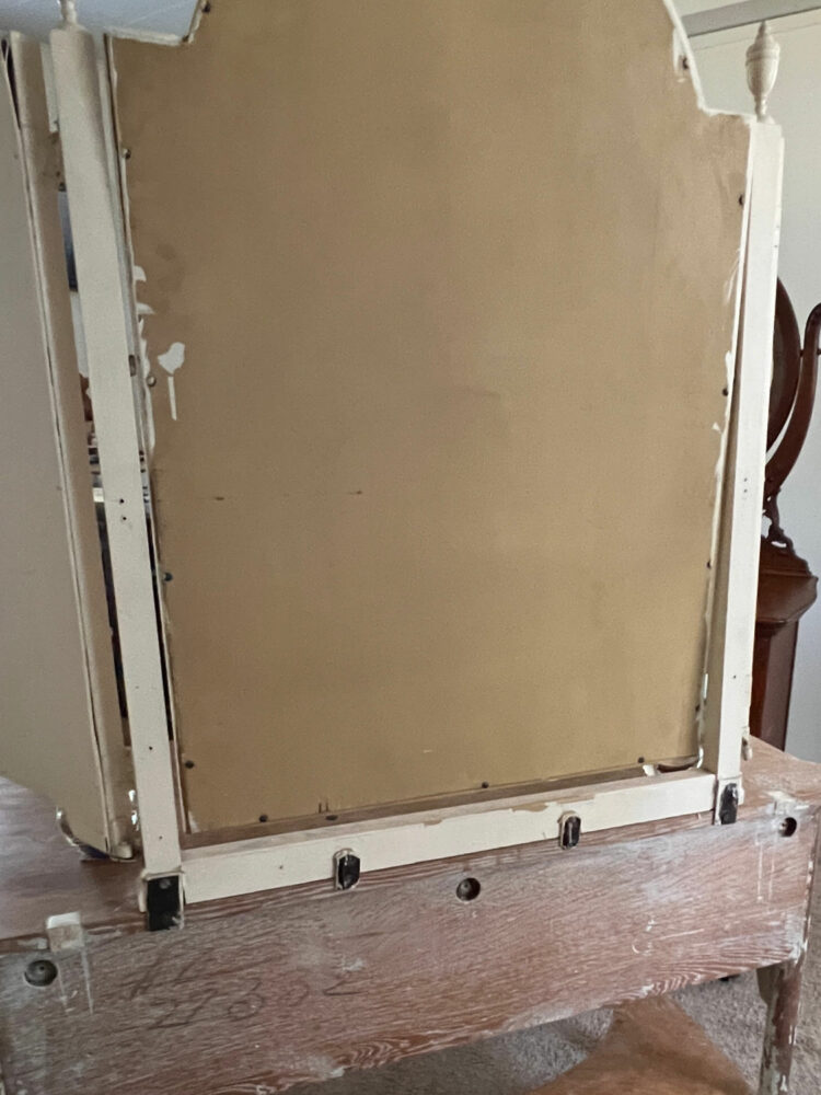 the back of the dressing table before showing how it is two pieces of furniture held together with random hardware