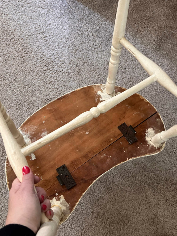 the bottom of the dressing table bench before