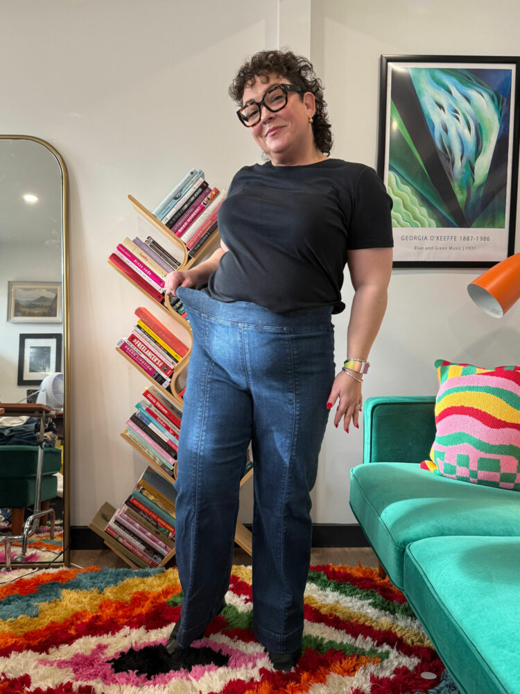 Alison Gary in a black t-shirt tucked into the Talbots Flare Leg Pull-on Travel Jeans