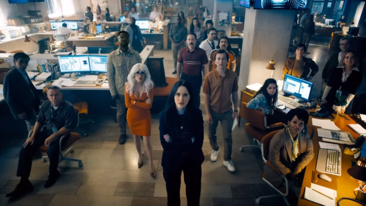 the staff at the daily planet looking at the television