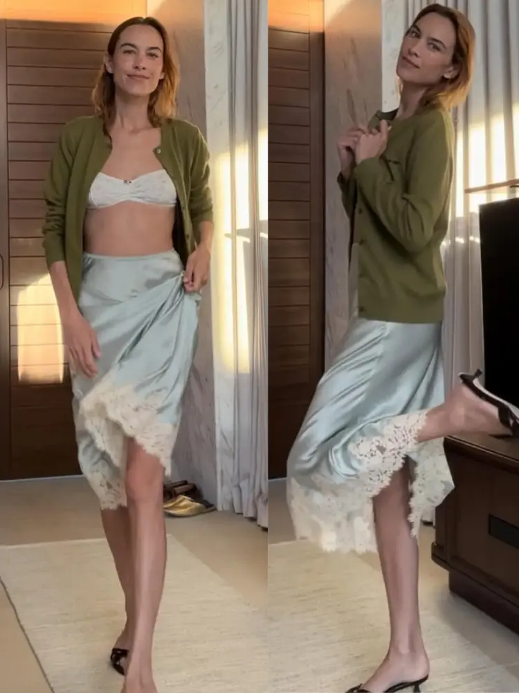 Let's Talk the Slip Skirt Trend for 2025 5 Model and television host Alexa Chung wearing a cardigan sweater and lace-trimmed slip skirt