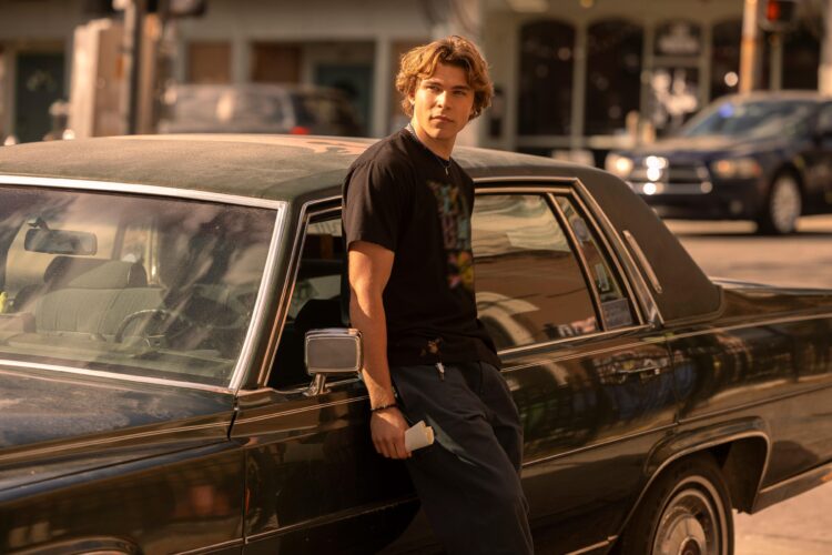 Weekend Reads for September 27 7 Charlie Cooper in The Runarounds leaning against his car, a Cadillac Fleetwood