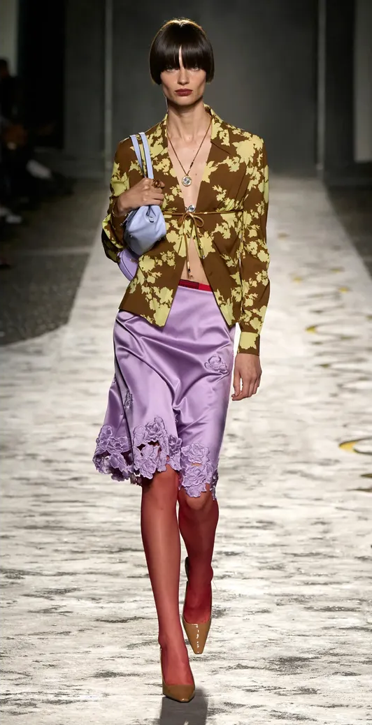 Let's Talk the Slip Skirt Trend for 2025 1 A runway look from Versace featuring a lace-trimmed silk skirt
