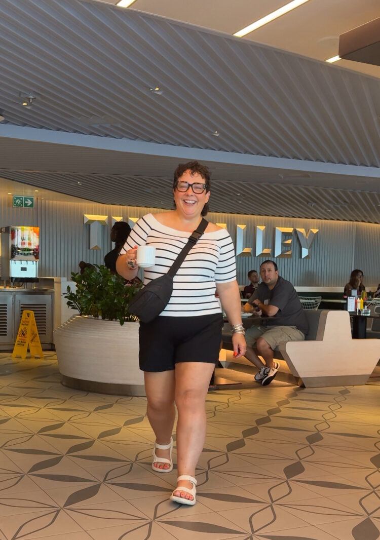 What I Wore on My Virgin Voyages Cruise by Wardrobe Oxygen: woman wearing black and white striped top and black shorts