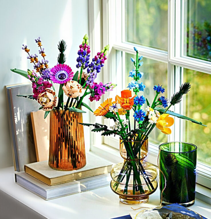 lego flowers in vases on a windowsill
