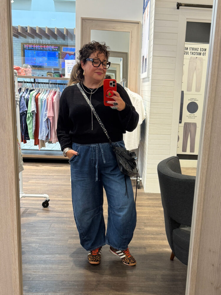 The Best Petite Barrel Jeans for Grown Women 8 wardrobe oxygen wearing a black cropped sweater with Mid Rise Easy Horseshoe Jeans from Gap