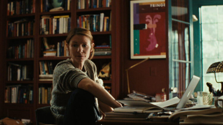 Claire Danes as Aggie in The Beast in Me, sitting in her study