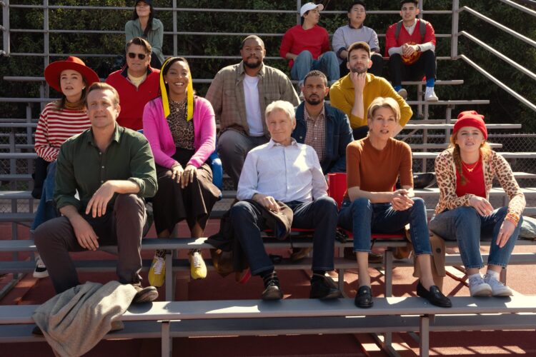 Weekend Reads for March 21st & 22nd 7 cast of shrinking sitting on bleachers at a soccer game in season 3